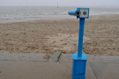 Not much to see from the telescope on the beach of rain-lashed Aberdovey. James Langton for The National