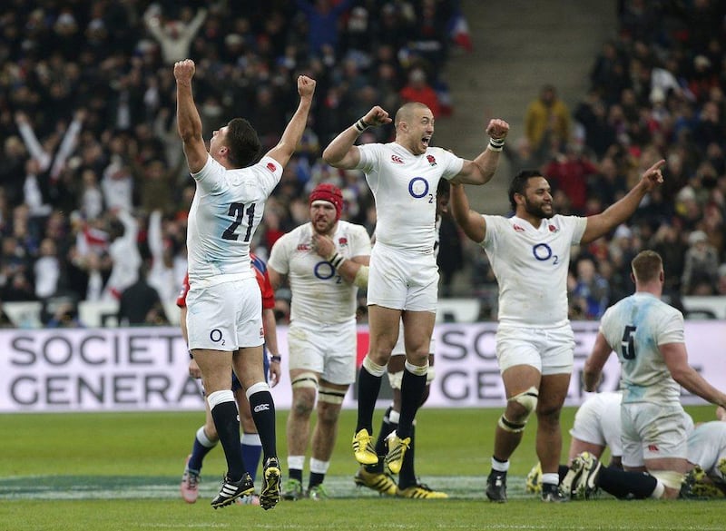 England’s players celebrate their victory after the Six Nations international rugby match between France and England at the Stade de France stadium in Saint-Denis, outside Paris, Saturday, March 19, 2016. Six Nations champion England completed their first Grand Slam in 13 years after beating France 31-21. (AP Photo/Thibault Camus)