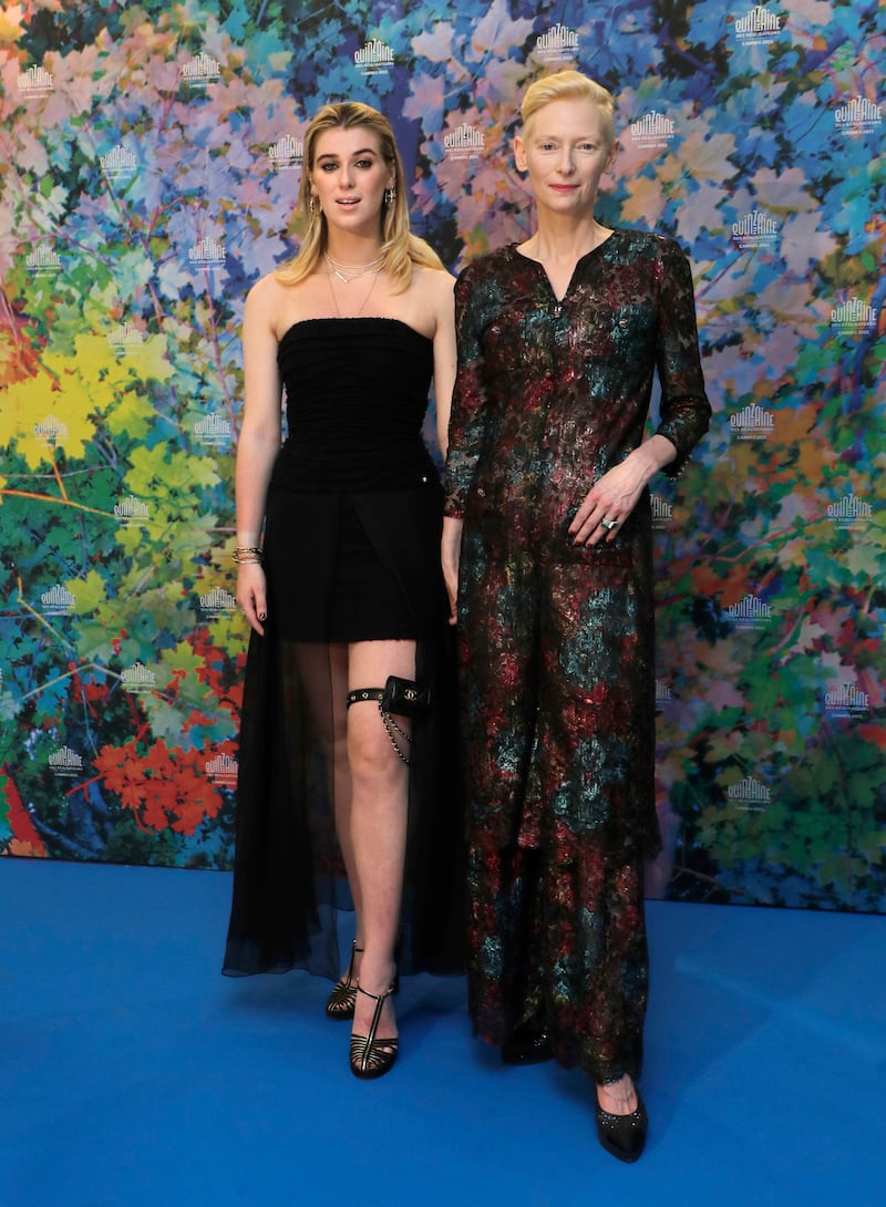 Honor Swinton Byrne and Tilda Swinton attend the photocall for 'The Souvenir- Part II' at the 74th annual Cannes Film Festival on July 8, 2021.