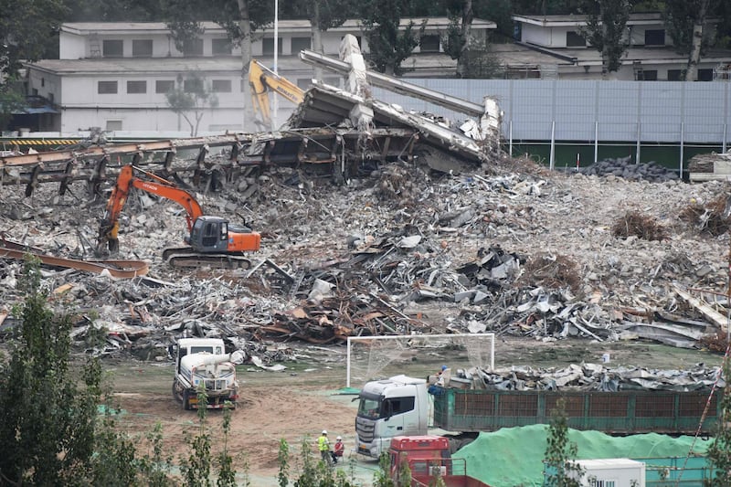Goalposts are seen on the field (bottom C) during the demolition. AFP