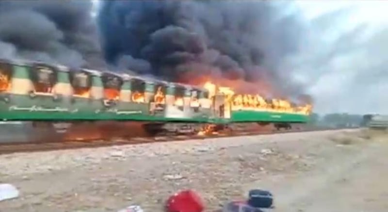 A fire burns a train carriage near the town of Rahim Yar Khan in the south of Punjab province, Pakistan October 31, 2019. Reuters
