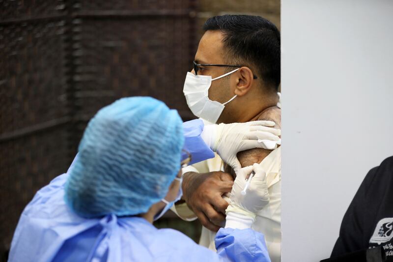 People getting the Covid 19 vaccine shot at the Ajman Society of Social & Cultural Development in Ajman on 23 September, 2021. More Emiratis in Ajman are taking the covid-19 vaccine and booster shots.  Pawan Singh/The National. Story by Salam