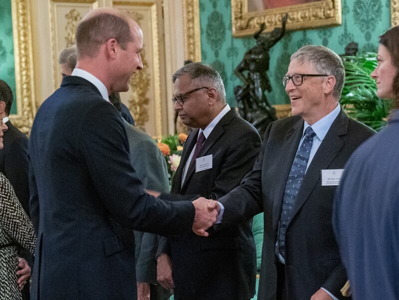 Prince William, Duke of Cambridge, speaks with Bill Gates at the reception. PA