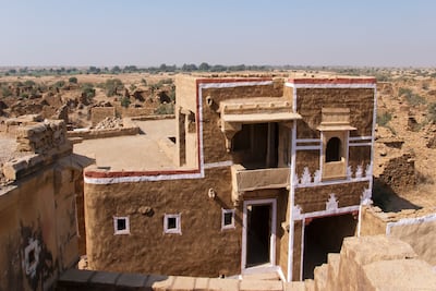 A restored home amid the ruins of Kuldhara, once a prosperous settlement that was abandoned overnight. Gustasp Irani and Jeroo Irani for The National