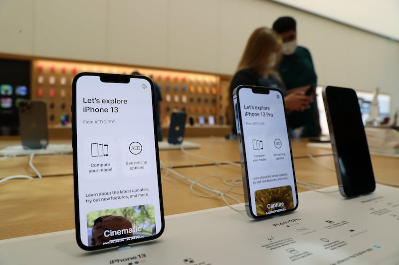 iPhone 13 phones on display at the Apple store in the Mall of the Emirates.