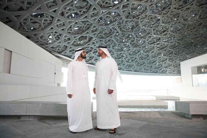 SAADIYAT ISLAND, ABU DHABI, UNITED ARAB EMIRATES - September 11, 2017: HH Sheikh Mohamed bin Zayed Al Nahyan, Crown Prince of Abu Dhabi and Deputy Supreme Commander of the UAE Armed Forces (R), and HH Sheikh Mohamed bin Rashid Al Maktoum, Vice-President, Prime Minister of the UAE, Ruler of Dubai and Minister of Defence (L), stand for a photograph while touring the newly constructed Louvre Abu Dhabi. 
( Ryan Carter / Crown Prince Court - Abu Dhabi )
---