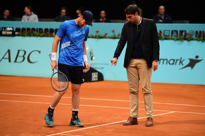 Andy Murray checks a shot with the the umpire. Getty