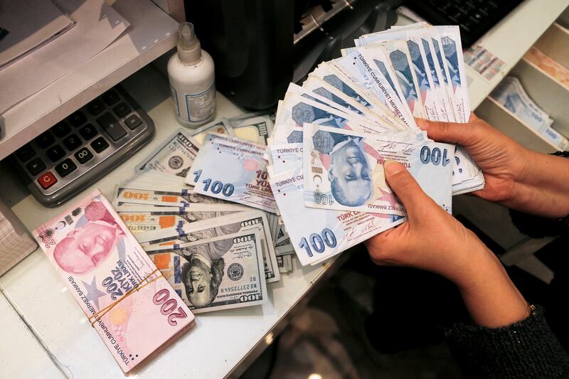 Turkish lira banknotes at a currency exchange office in Ankara. The Turkish lira is also among the worst performers among emerging market currencies and is down nearly 9.5 per cent so far in 2024. Reuters