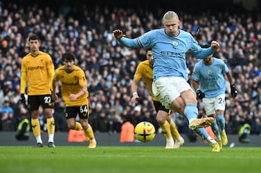 Manchester City's Norwegian striker Erling Haaland shoots a penalty kick and scores his team second goal during the English Premier League football match between Manchester City and Wolverhampton Wanderers  at the Etihad Stadium in Manchester, north west England, on January 22, 2023.  (Photo by Paul ELLIS / AFP) / RESTRICTED TO EDITORIAL USE.  No use with unauthorized audio, video, data, fixture lists, club/league logos or 'live' services.  Online in-match use limited to 120 images.  An additional 40 images may be used in extra time.  No video emulation.  Social media in-match use limited to 120 images.  An additional 40 images may be used in extra time.  No use in betting publications, games or single club/league/player publications.   /  