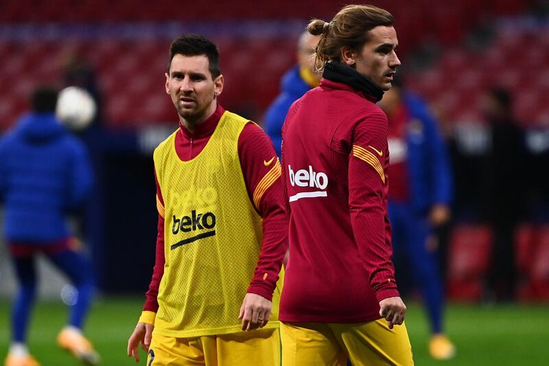 Antoine Griezmann and Lionel Messi warm up before the match between Atletico Madrid and Barcelona at the Wanda Metropolitano. AFP