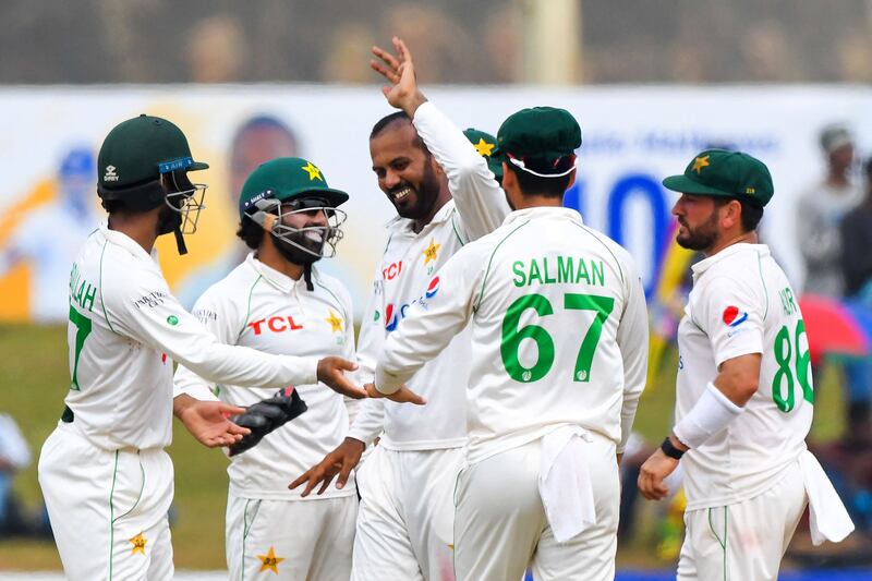 Pakistan bowler Nauman Ali celebrates with teammates after taking the wicket of Sri Lanka captain Dimuth Karunaratne for 61. AFP