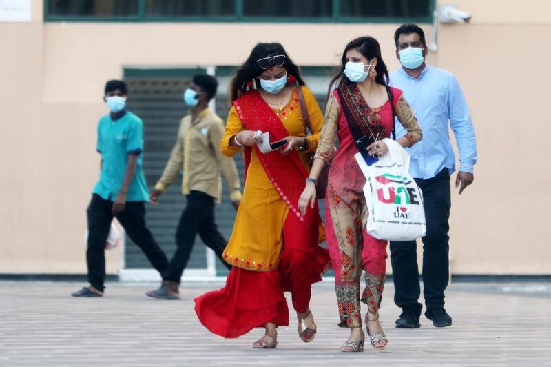 DUBAI, UNITED ARAB EMIRATES , October 9 – 2020 :- People wearing protective face mask as a preventive measure against the spread of coronavirus in Bur Dubai area in Dubai. (Pawan Singh / The National) For News/Stock/Online.