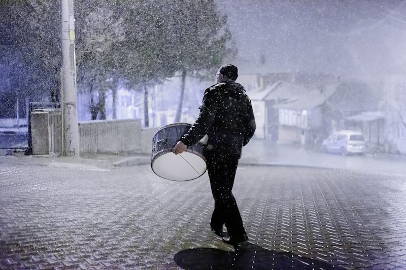 A Ramadan drummer makes his way through the town of Cukurkoy, Turkey. Reuters