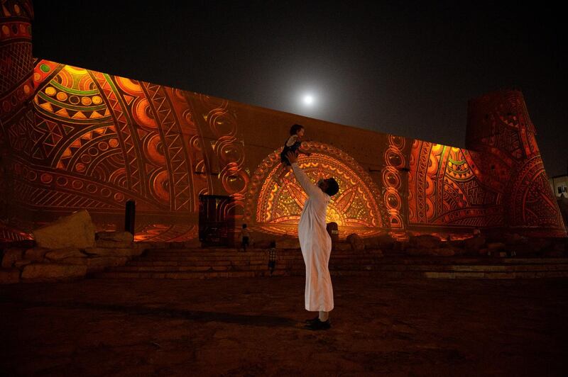 During the Noor Riyadh festival, Al Ruzaiza's artworks were projected onto the Masmak Fort – which Al Ruzaiza used in the well-known logo he deisgned for the 100th anniversary of the founding of the Saudi state. Courtesy Noor Riyadh