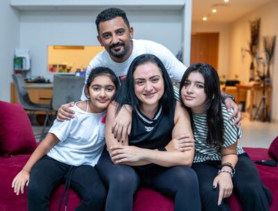 Mai Hamed with husband Amir and daughters, Jana, 12, and Salma, 9. Victor Besa/The National