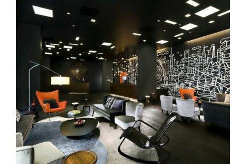 The chic black lobby at the upmarket and centrally located Thompson Toronto hotel.