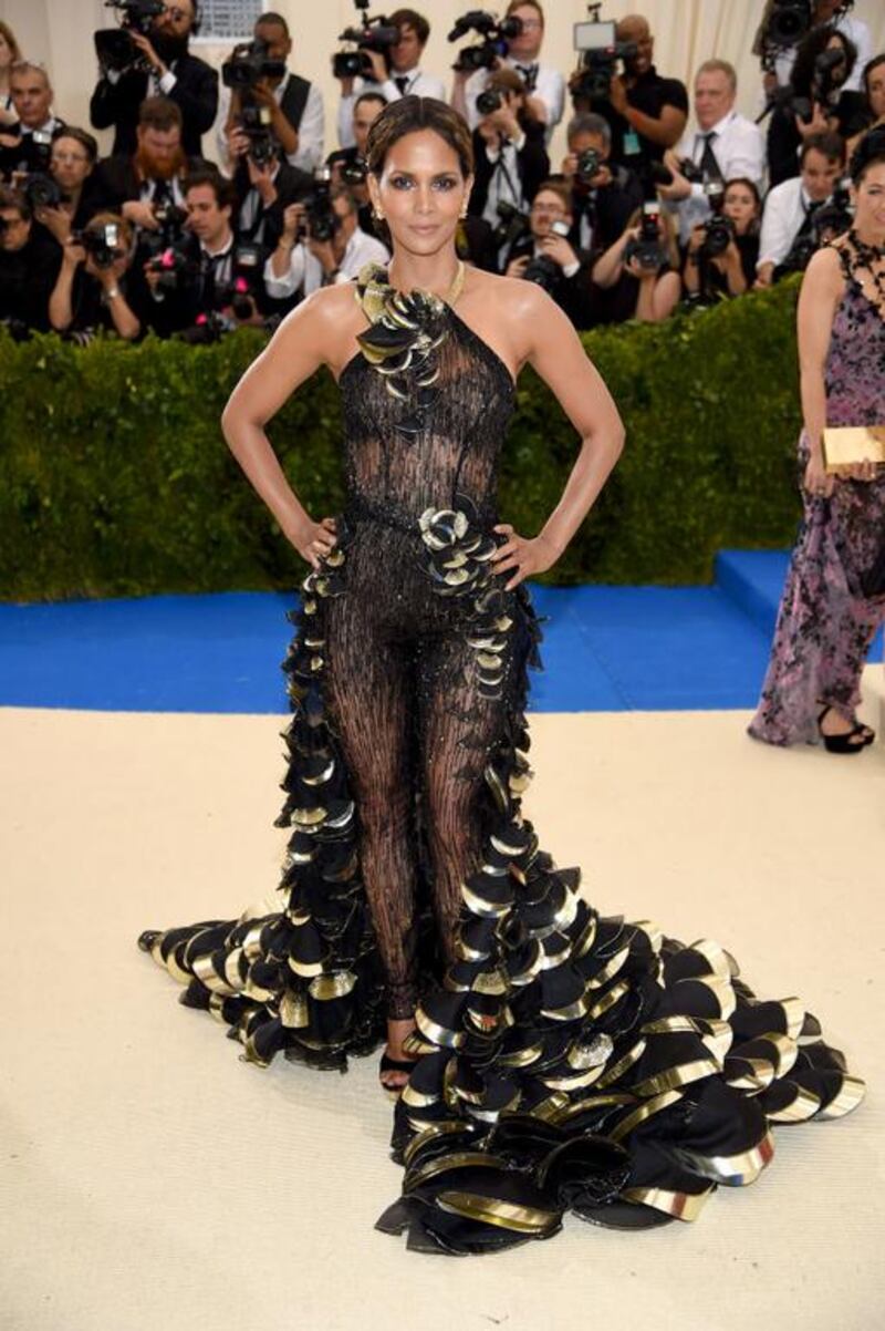 As always, Halle Berry looks regal in a beaded black jumpsuit by Atelier Versace. Courtesy of Versace