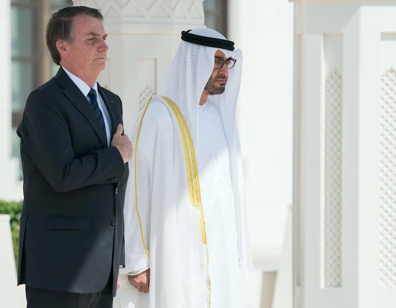 ABU DHABI, UNITED ARAB EMIRATES - October 27, 2019: HH Sheikh Mohamed bin Zayed Al Nahyan, Crown Prince of Abu Dhabi and Deputy Supreme Commander of the UAE Armed Forces (R) and HE Jair Bolsonaro, President of Brazil (L), stand for the national anthem during an official reception at Qasr Al Watan.

( Eissa Al Hammadi for the Ministry of Presidential Affairs )
---