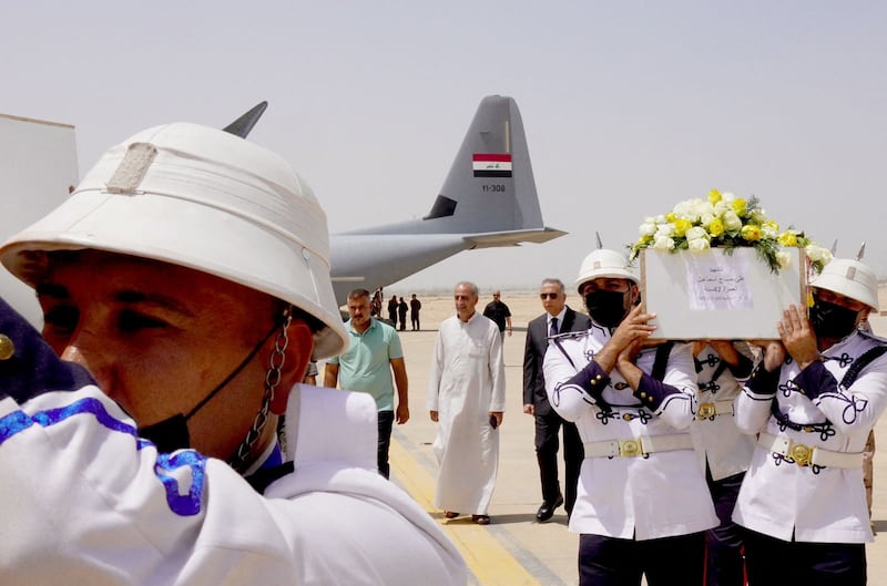 Honour guards carry the coffins of victims, who were killed in an attack on a mountain resort in Iraq's northern province of Dohuk, at a funeral ceremony at Baghdad International Airport. Photo:  Iraqi Prime Minister's Media Office