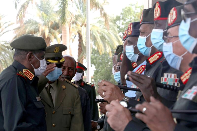 Chief of Staff of Eritrean Defence Forces Major General Filipos Woldeyohannes (2-L) is welcomed by Sudanese Army Chief of Staff General Mohamed Osman al-Hussein (L) and military officials upon arrival in Khartoum, Sudan. EPA