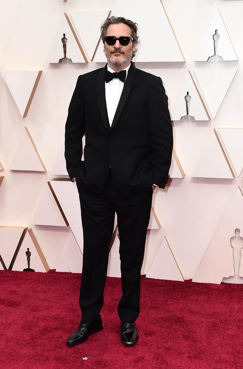 Joaquin Phoenix, wearing Stella McCartney, arrives at the Oscars on Sunday, February 9, 2020, at the Dolby Theatre in Los Angeles. AP