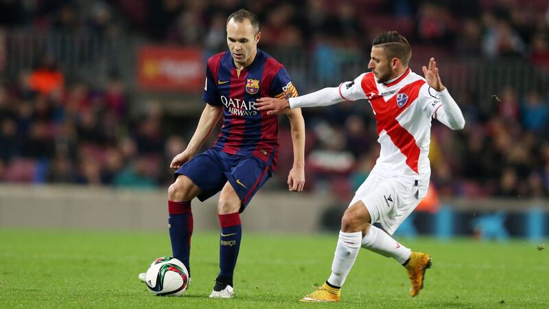 BARCELONA, SPAIN - DECEMBER 16: Andres Iniesta of FC Barcelona manages the ball during the Copa del Rey 1/16 2nd leg match between FC Barcelona and SD Huesca at Camp Nou on December 16, 2014 in Barcelona, Spain.  (Photo by Miguel Ruiz/FC Barcelona via Getty Images)