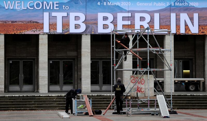 Workers make preparations for the upcoming International Tourism Trade Fair ITB as officials consider cancelling the fair for the spread of the coronavirus in the country in Berlin, Germany, February 28, 2020.   REUTERS/Fabrizio Bensch