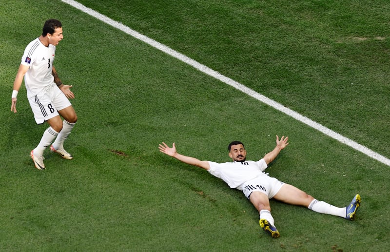 Iraq's Ayman Hussein celebrates scoring his first goal. Reuters