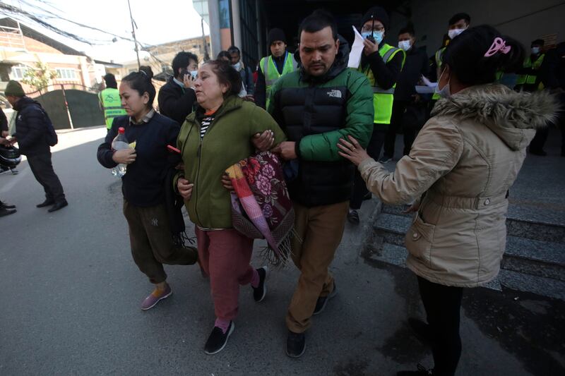 Relatives of the plane's passengers at Kathmandu airport in Nepal. AP