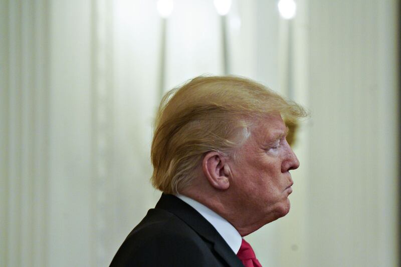 U.S. President Donald Trump pauses while speaking during an Immigration and Customs Enforcement (ICE) and Customs and Border Protection event in the East Room of the White House in Washington, D.C., U.S., on Monday, Aug. 20, 2018. Trump has sought to make immigration a central issue in the midterm elections, highlighting a fringe movement on the left to eliminate ICE over what some immigration advocates say has been overreach by the agency, created in the wake of the Sept. 11 attacks. Photographer: Andrew Harrer/Bloomberg