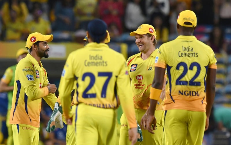 Teammates congratulate Chennai Super Kings cricketer Shane Watson (2R) after effecting the run-out of Delhi Daredevils cricketer Shreyas Iyer during the 2018 Indian Premier League (IPL) Twenty20 cricket match between Chennai Super Kings and Delhi Daredevils at the Maharashtra Cricket Association Stadium in Pune on April 30, 2018. / AFP PHOTO / INDRANIL MUKHERJEE / ----IMAGE RESTRICTED TO EDITORIAL USE - STRICTLY NO COMMERCIAL USE----- / GETTYOUT