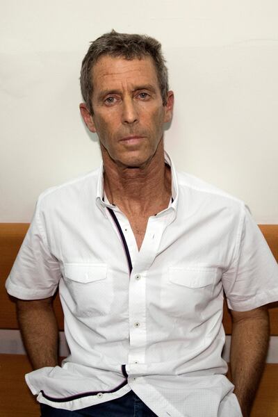French-Israeli diamond magnate Beny Steinmetz sits at the Israeli Rishon Lezion Justice court, near Tel Aviv on August 14, 2017 after he was detained as part of an international money laundering investigation, authorities said. 
Israeli police said five suspects had been detained for questioning on suspicions including money laundering, fraud, forgery, obstruction of justice and bribery. / AFP PHOTO / JACK GUEZ