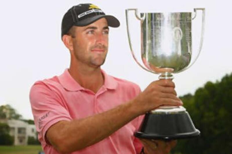 Geoff Ogilvy poses with championship trophy after winning the Australian PGA Championship - his first on Australian soil.