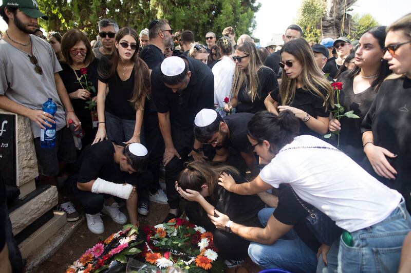 Family and friends of May Naim, 24, who was killed by Palestinians militants at a party near the Israeli border with the Gaza Strip, during her funeral in Gan Haim, Israel. Getty Images