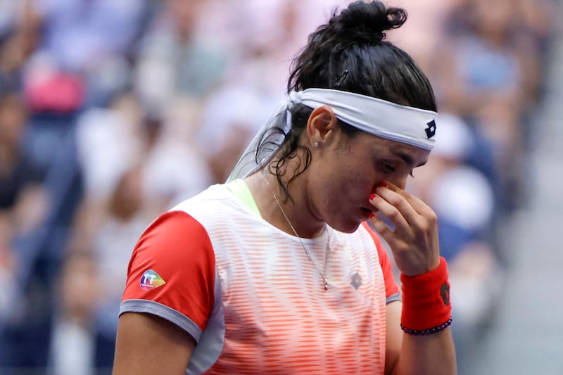 Tunisia's Ons Jabeur reacts while playing Poland's Iga Swiatek in the 2022 US Open Tennis tournament women's singles final. AFP