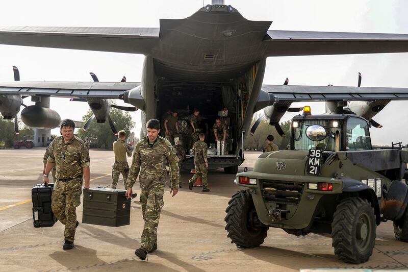 Military personnel unload stores during the evacuation of British citizens in Sudan. Photo: MoD