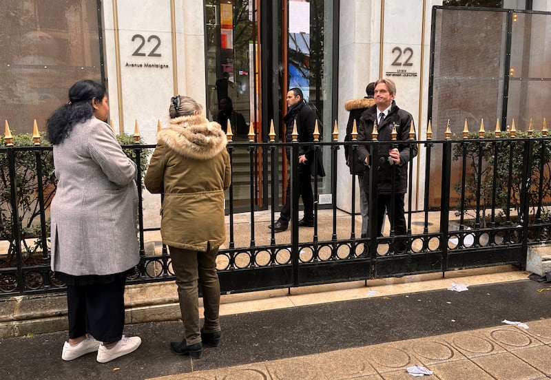 Security staff stand in front of the headquarters of luxury retailer Louis Vuitton after a protest by labour union members. Reuters