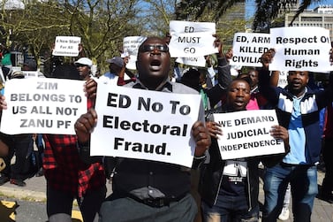 Zimbabweans protesting outside the World Economic Forum on Africa in Cape Town, South Africa. AP