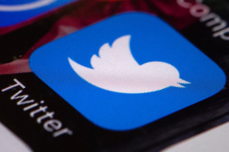 FILE- This April 26, 2017, file photo shows the Twitter app on a mobile phone in Philadelphia. Twitter is testing a 280-character limit, doubling the current length restriction that��������s been in place since the company��������s founding 11 years ago. The test is being made available to a small subset of users and applies to languages other than Japanese, Korean, and Chinese. (AP Photo/Matt Rourke, File)
