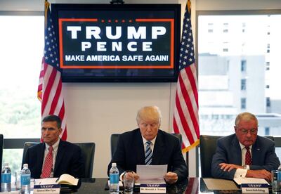 Donald Trump participates in a roundtable discussion on national security in New York with Gen Mike Flynn, left, and Lt Gen Keith Kellogg. AP Photo