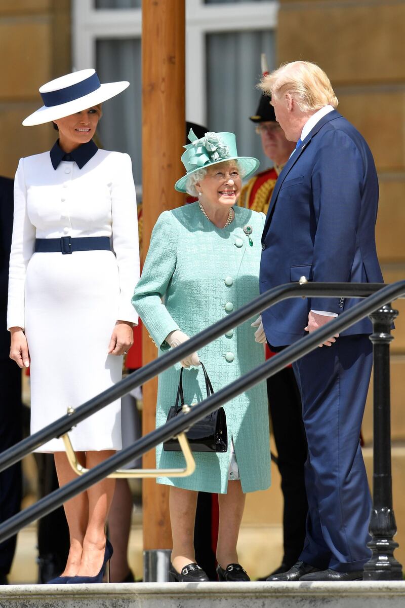 LONDON, ENGLAND - JUNE 03:  Queen Elizabeth II stands with US President Donald Trump and US First Lady Melania Trump during a welcome ceremony at Buckingham Palace on June 3, 2019 in London, England. President Trump's three-day state visit will include lunch with the Queen, and a State Banquet at Buckingham Palace, as well as business meetings with the Prime Minister and the Duke of York, before travelling to Portsmouth to mark the 75th anniversary of the D-Day landings.  (Photo by Toby Melville - WPA Pool/Getty Images)