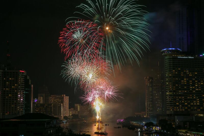 Fireworks explode over Chao Phraya River during New Year's celebrations in Bangkok, Thailand. Athit Perawongmetha / Reuters