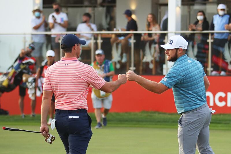 Rory McIlroy and Tyrrell Hatton fist bump on the 18th green during Day Three of the Abu Dhabi HSBC Championship. Getty Images