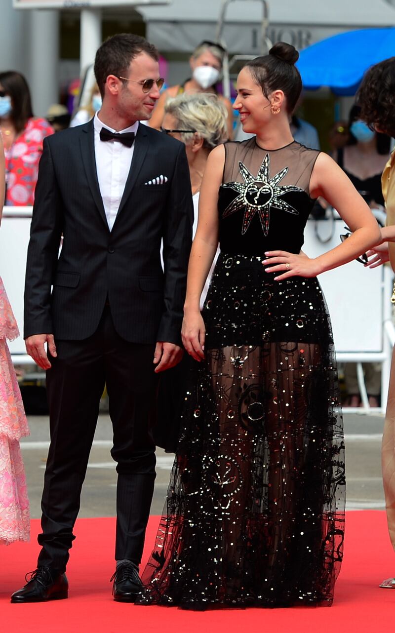 Yonatan Kugler and Nur Fibak arrive for the screening of 'Le Genou D'Ahed' during the 74th annual Cannes Film Festival on July 7, 2021.
