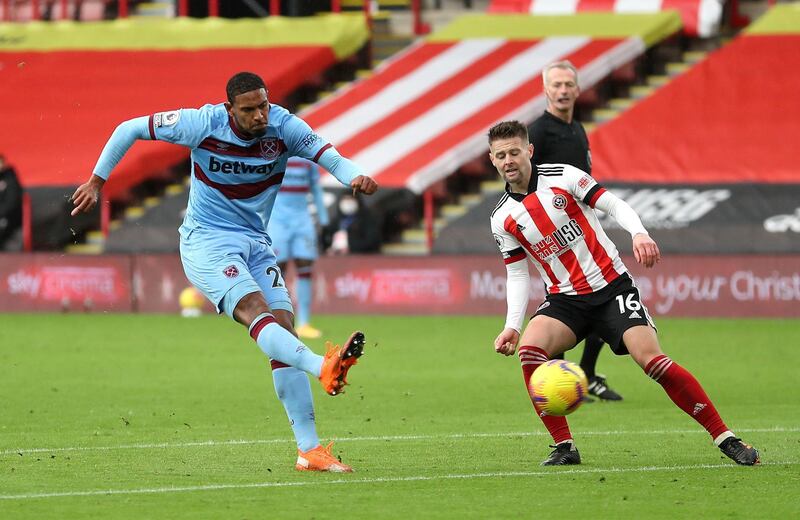 West Ham United's Sebastien Haller (left) scores his side's first goal of the game during the Premier League match at Bramall Lane, Sheffield. PA Photo. Picture date: Sunday November 22, 2020. See PA story SOCCER Sheff Utd. Photo credit should read: Cath Ivill/PA Wire. RESTRICTIONS: EDITORIAL USE ONLY No use with unauthorised audio, video, data, fixture lists, club/league logos or "live" services. Online in-match use limited to 120 images, no video emulation. No use in betting, games or single club/league/player publications.