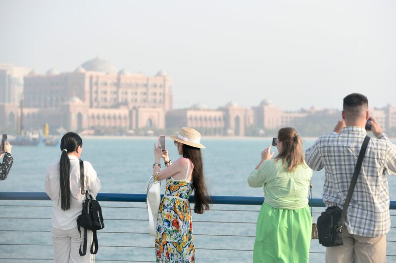 Tourists in Abu Dhabi. International visitors to the UAE will be able to use their home digital wallets for taxis and shopping. Khushnum Bhandari / The National