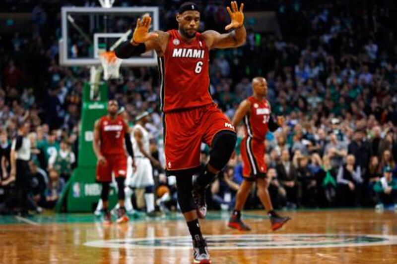 Miami Heat's LeBron James celebrates after scoring a late winner against Boston.