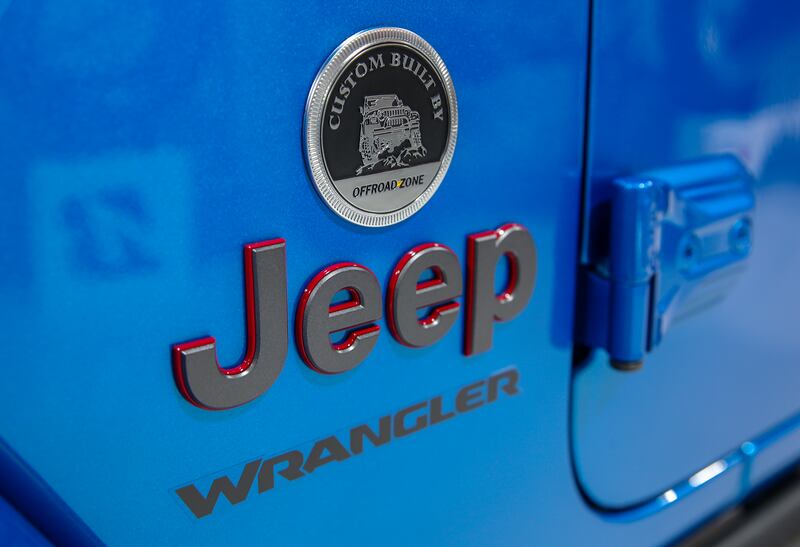 A custom badge identifies the work done on a 2023 Jeep Wrangler Rubicon