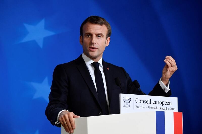 France's President Emmanuel Macron gestures as he addresses media representatives at a press conference during a European Union Summit at European Union Headquarters in Brussels on October 18, 2019.  / AFP / John THYS
