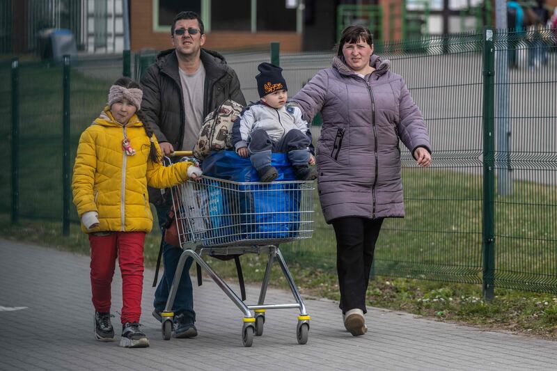 Refugees from Ukraine approach the border crossing into Poland in Medyka on April 7, 2022. AFP